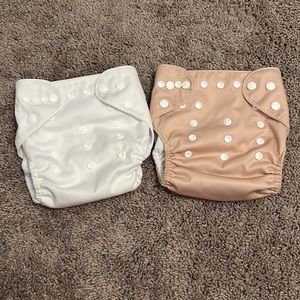 Tan/cream and white reusable cloth diapers + inserts